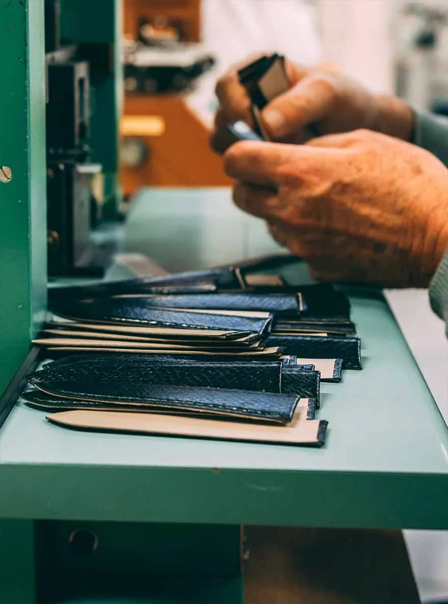 Handmade craftsmanship of an ETERNEL leather strap, made in France